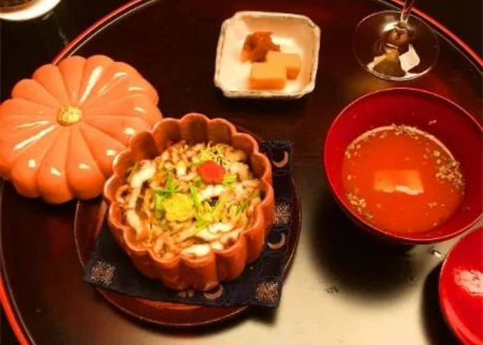 A serving at Kikunoi Roan, a kaiseki restaurant in Kyoto. It is served in a dish that looks like a pumpkin.